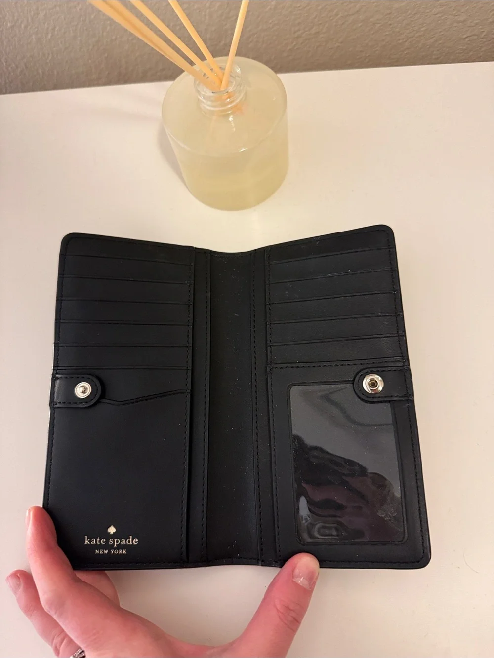 kate spade black zip-around continental wallet with gold logo